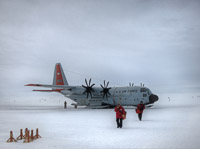 Cryogenics technicians Kathleen Dewahl and Flint Hamblin arrive at the South Pole after a three hour flight from McMurdo Station on the coast of Antarctica. (<i>Steffen Richter, Harvard University</i>)